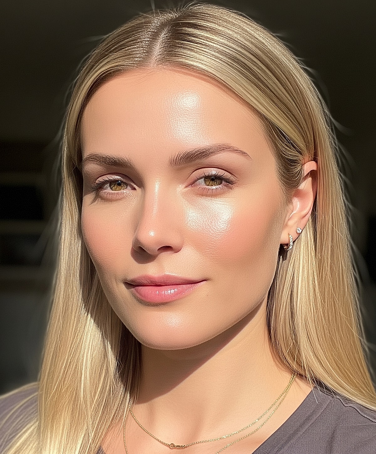 Young woman with long blonde hair and glowing skin