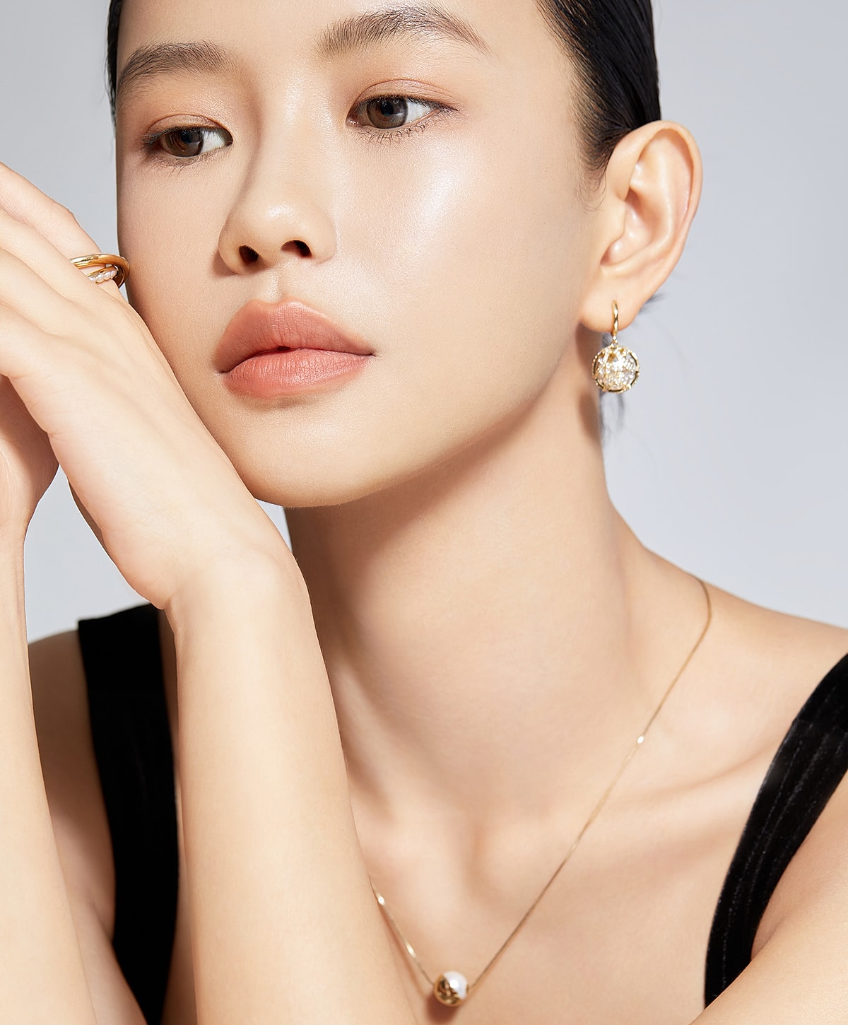 Woman wearing elegant jewelry, close-up portrait.
