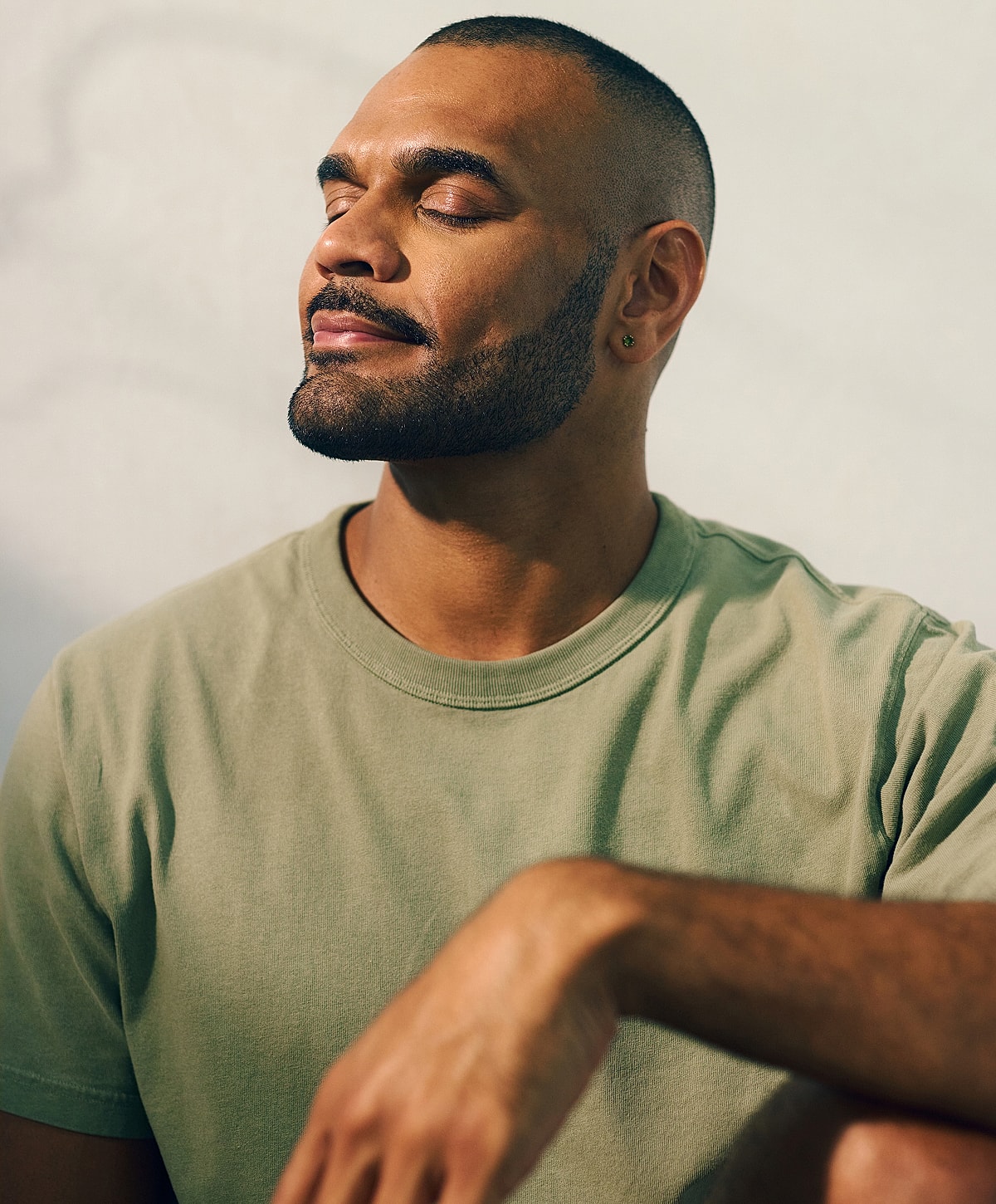 Man with closed eyes and a serene expression.